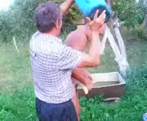 Mature father takes douche bare outdoor