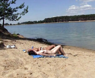 2 torrid russian young getting a sunburn on the free beach.