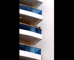 Spycam of duo on balcony